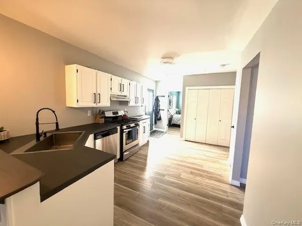 a white refrigerator freezer sitting in a kitchen
