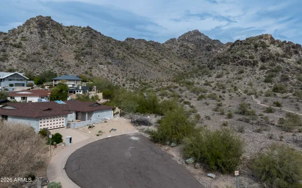 an aerial view of a house with mountain view
