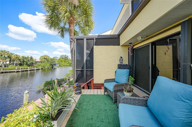 a balcony with furniture and a potted plant