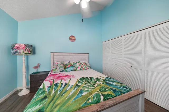 a bedroom with a bed and a table