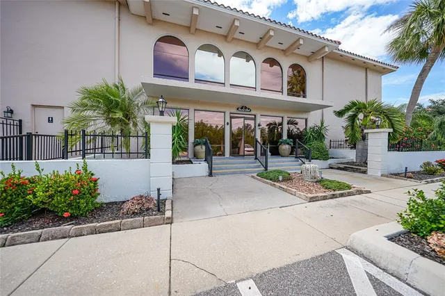 a view of a building with potted plants