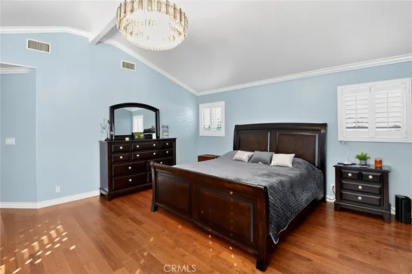 a bedroom with a bed and a table