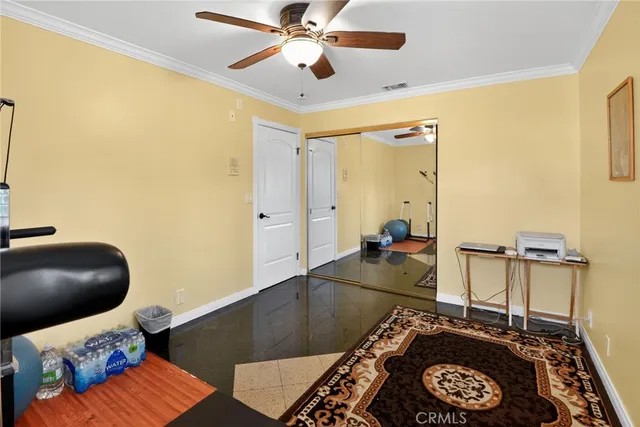 a living room with a couch and a chandelier
