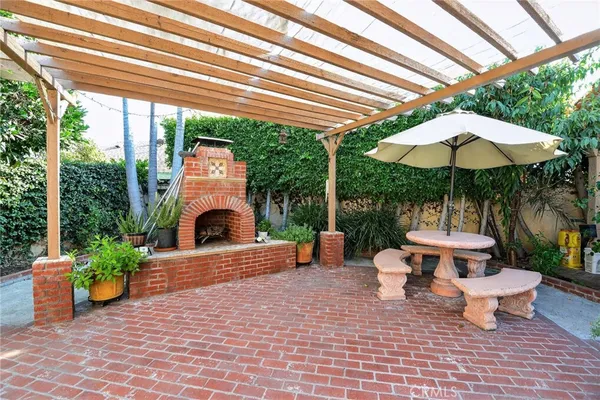 a view of a patio with furniture and backyard