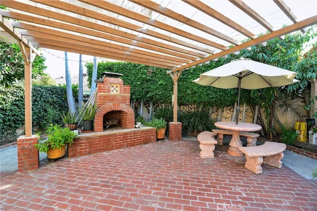 a view of a patio with furniture and backyard