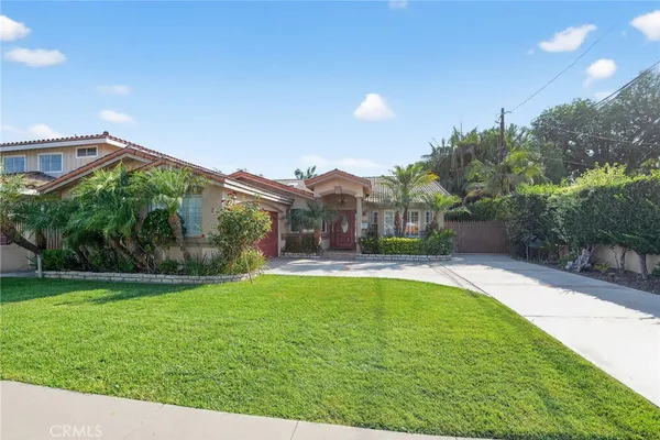 a view of a house with a yard porch and sitting area