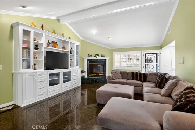 a living room with furniture flat screen tv and a fireplace