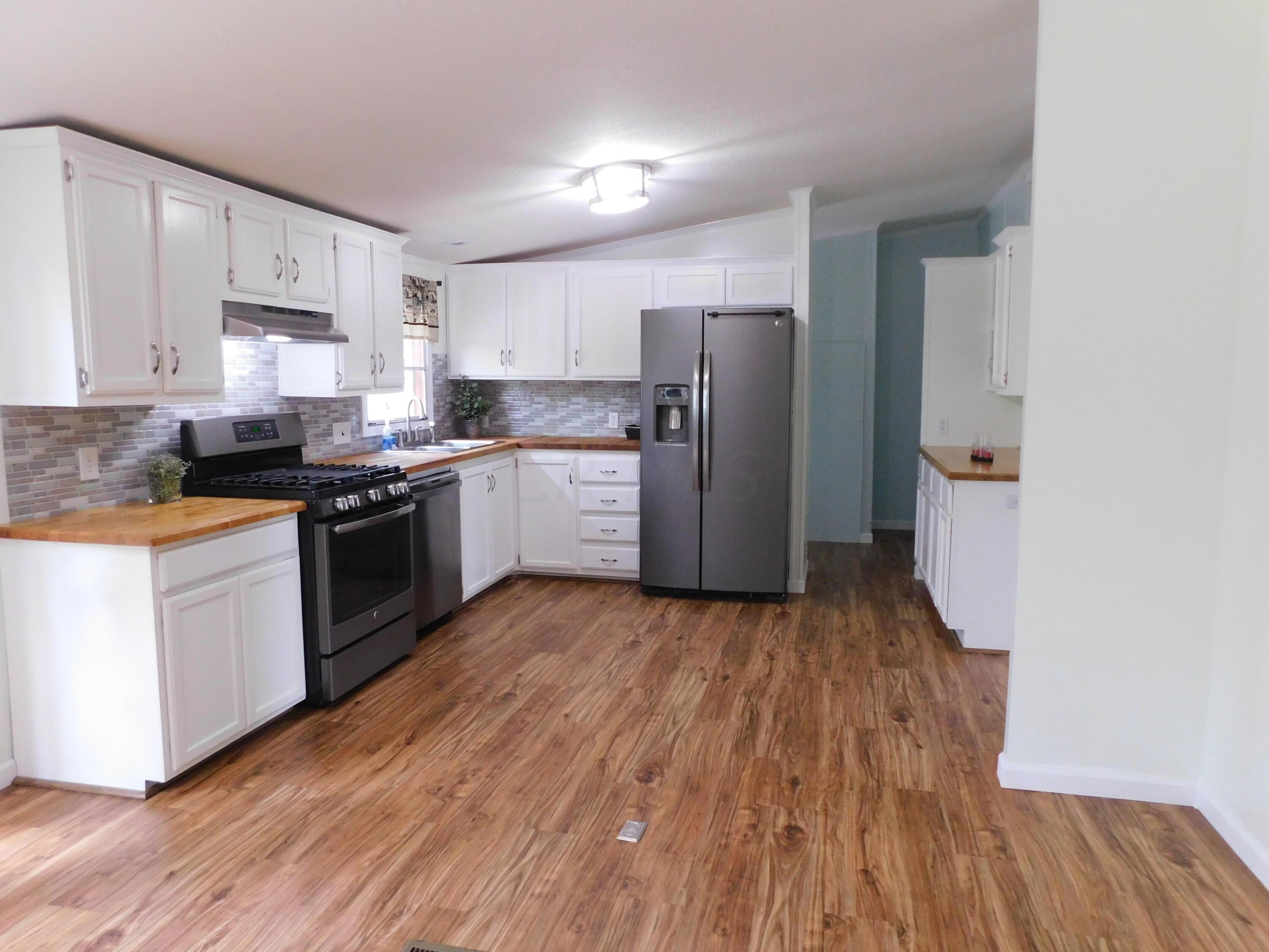 4711 Walnut Road, Unit LOT H8 Buckeye Lake, OH 43008 - Photo 8 of 42 Kitchen featuring butcher block countertops