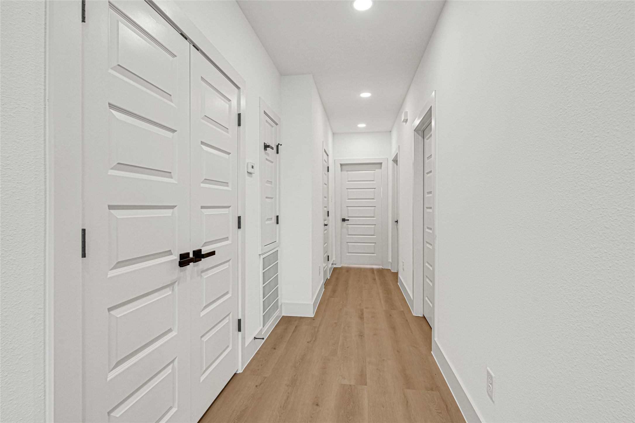 327 Tite Street, Unit B Houston, TX 77029 - Photo 14 of 22 a view of a hallway with wooden floor