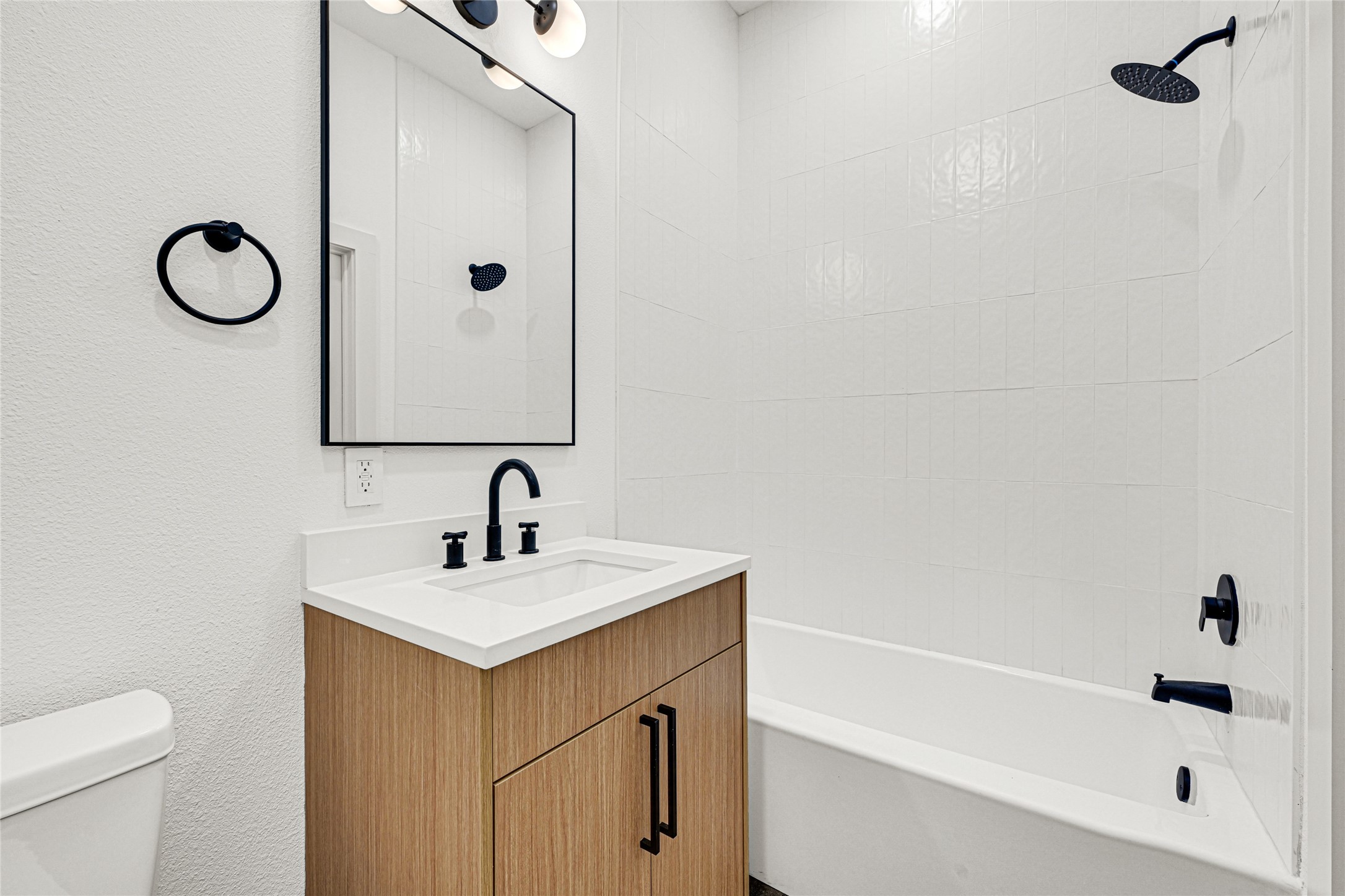 327 Tite Street, Unit B Houston, TX 77029 - Photo 17 of 22 a bathroom with a sink and a mirror