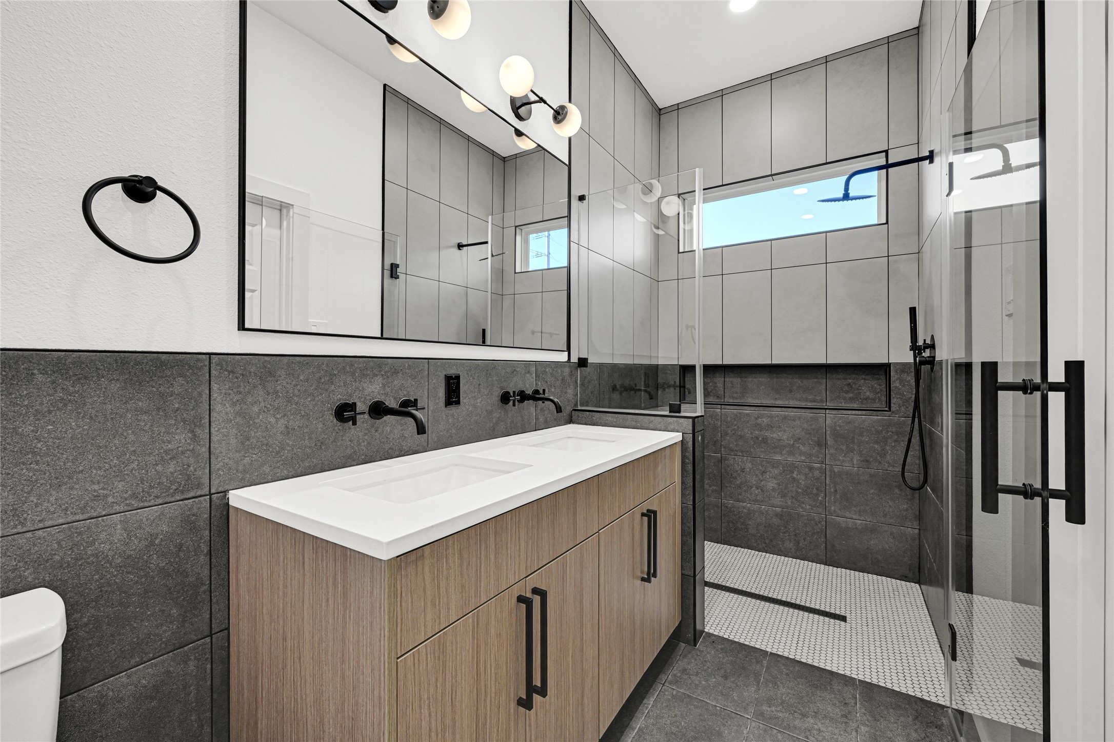 327 Tite Street, Unit B Houston, TX 77029 - Photo 22 of 22 a bathroom with a sink vanity and a mirror