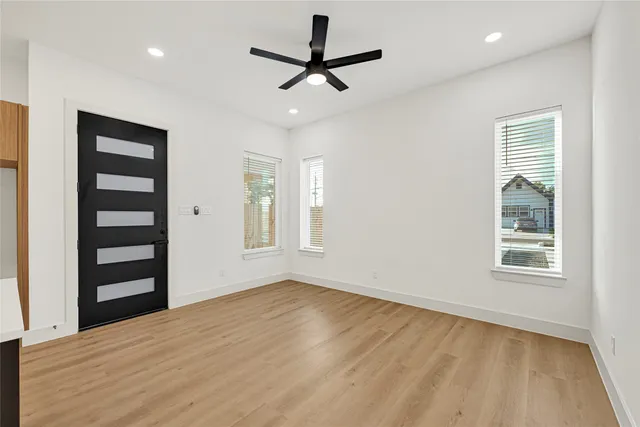 a kitchen with granite countertop a sink a counter space appliances and cabinets