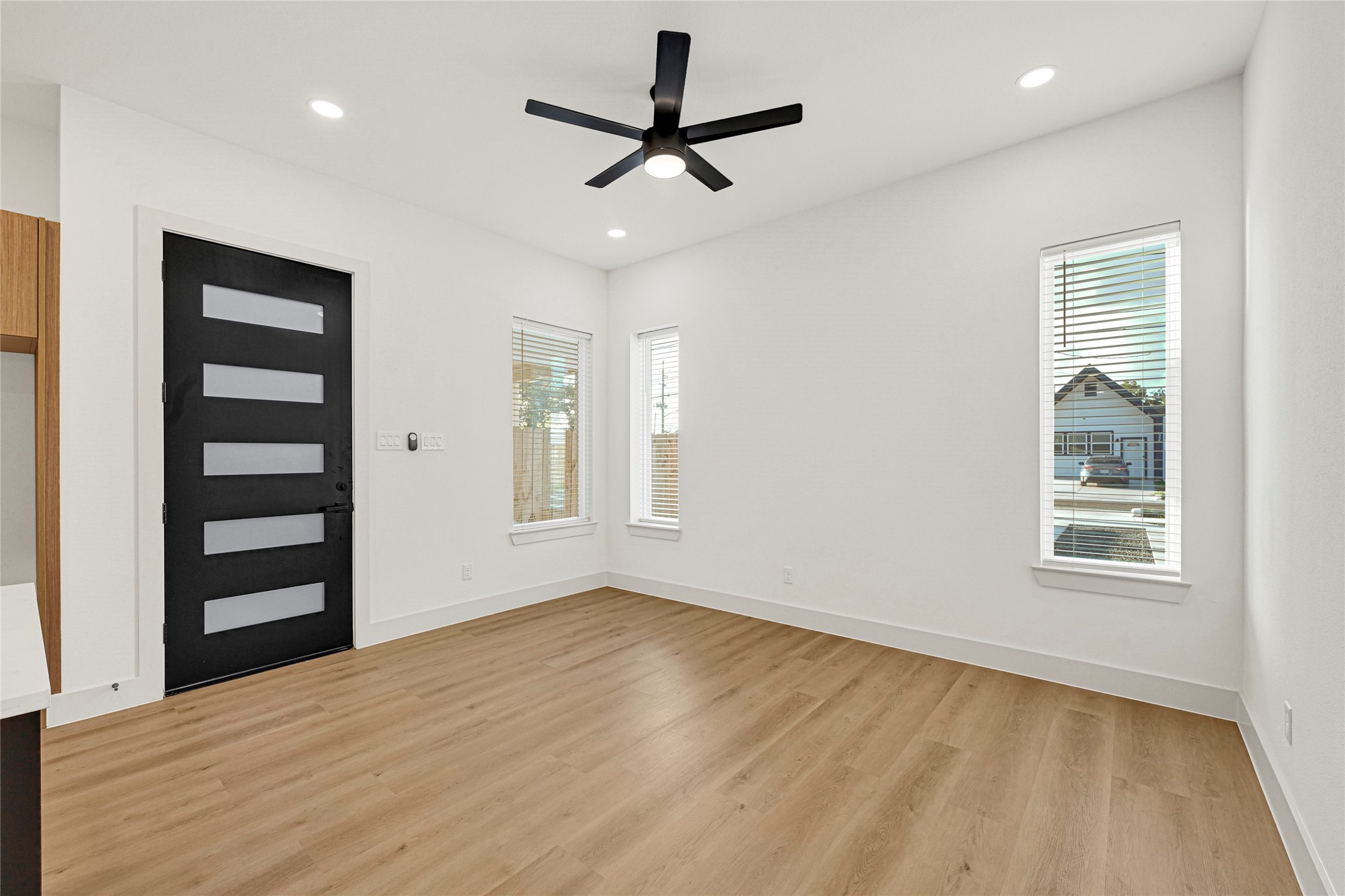 327 Tite Street, Unit B Houston, TX 77029 - Photo 8 of 22 a view of a livingroom with a ceiling fan and window