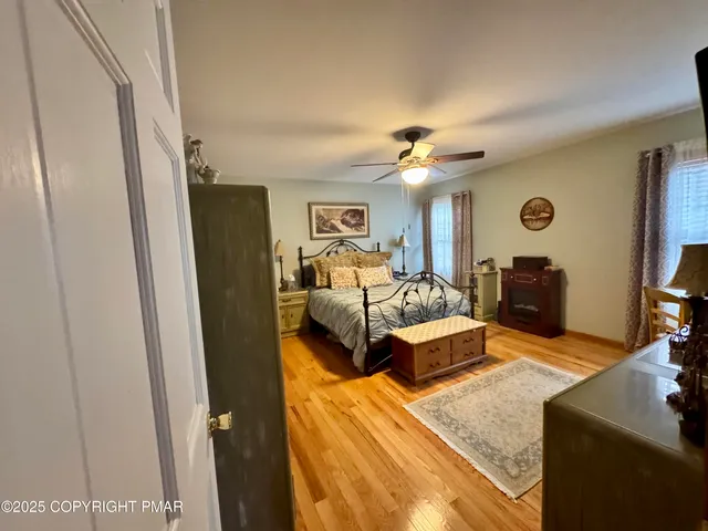 a bedroom with furniture and a mirror