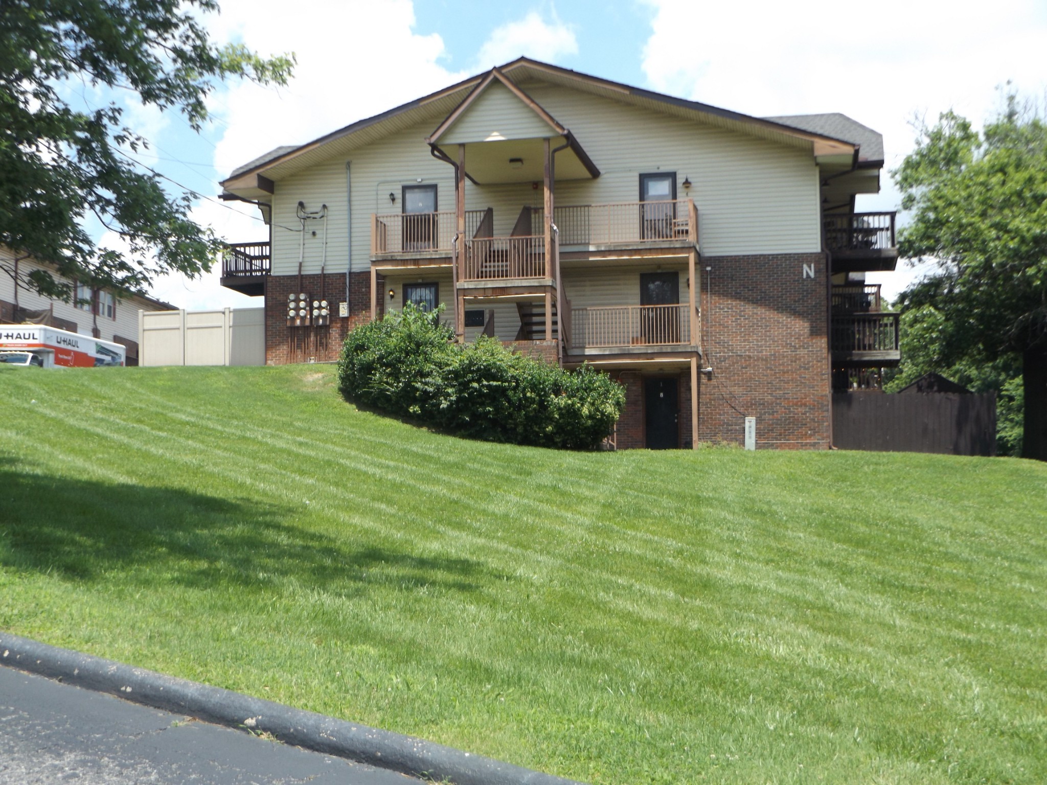 500 Paragon Mills Road, Unit N5 Nashville, TN 37211 - Photo 2 of 12 a front view of a house with a yard and garage