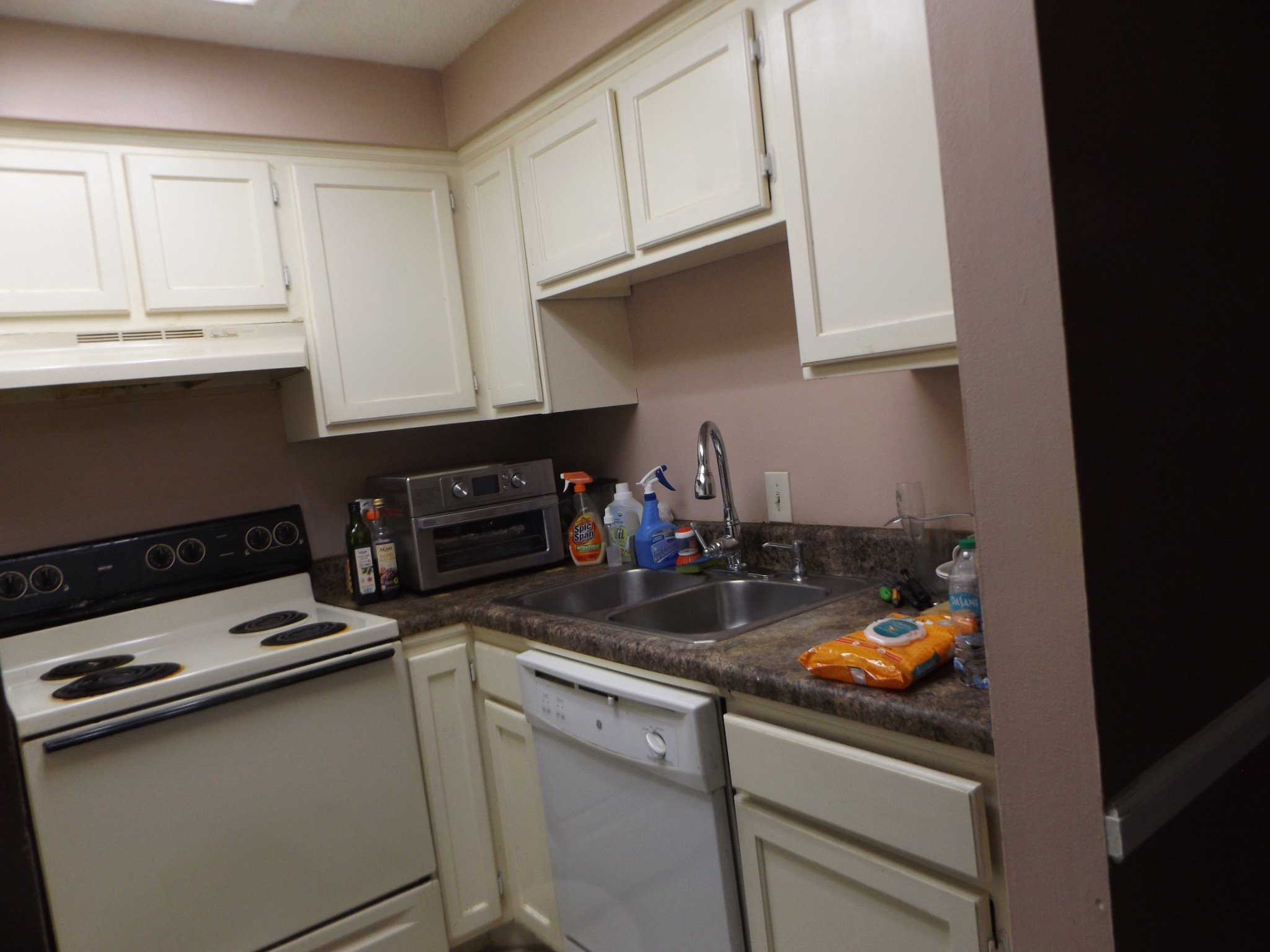 500 Paragon Mills Road, Unit N5 Nashville, TN 37211 - Photo 7 of 12 a kitchen with stainless steel appliances granite countertop a sink stove and cabinets