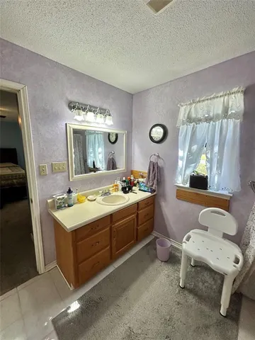 a room with a bed and a mirror