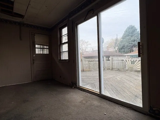 a view of an empty room and window