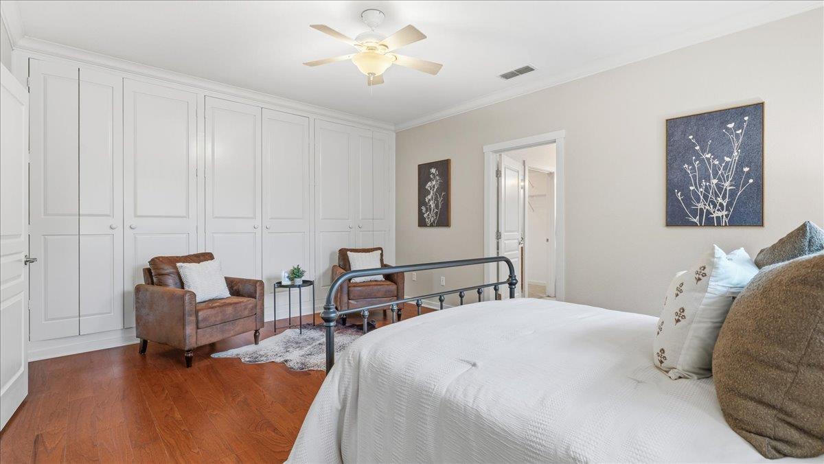 1181 Segolily Lane Lincoln, CA 95648 - Photo 13 of 31 a bedroom with a bed and a chandelier