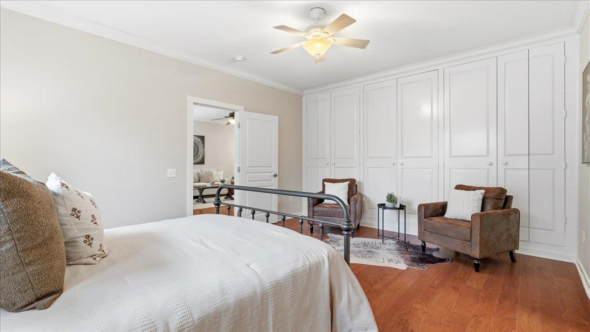 1181 Segolily Lane Lincoln, CA 95648 - Photo 16 of 31 a bedroom with a bed and a chandelier