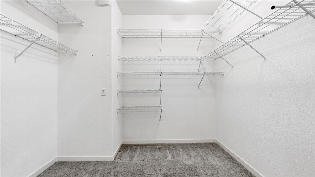 1181 Segolily Lane Lincoln, CA 95648 - Photo 19 of 31 a view of a room with racks on the wall