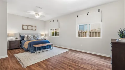 a bedroom with a bed and a dresser