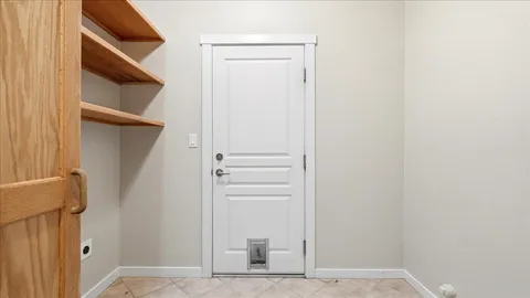 a front view of a house with a yard and street