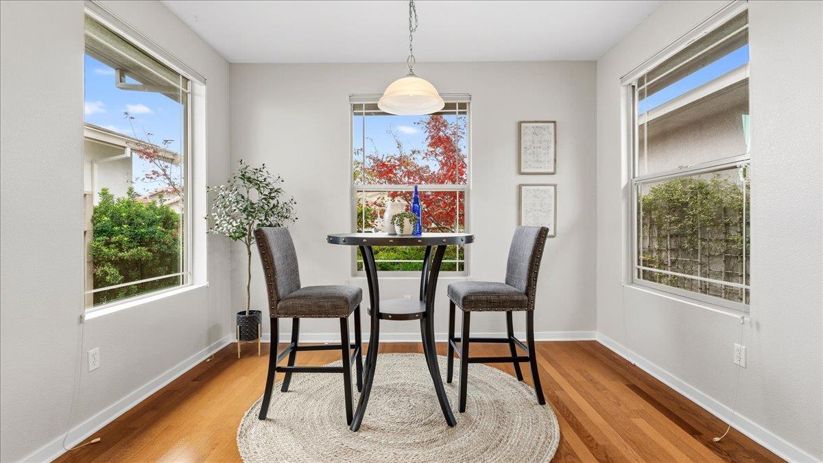 1181 Segolily Lane Lincoln, CA 95648 - Photo 7 of 31 a view of a dining room with furniture window and wooden floor