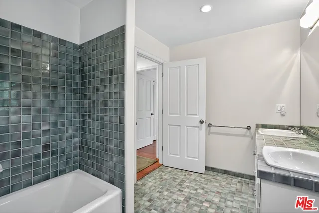 a view of a swimming pool with a patio and a yard