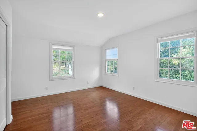 a view of yard with swimming pool and green space