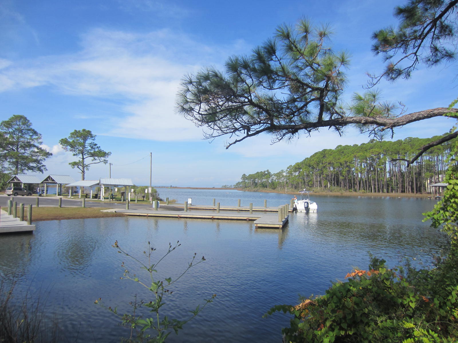 69 West Nursery Road Santa Rosa Beach, FL 32459 - Photo 3 of 6 a view of a lake with a house in the background