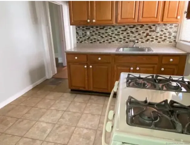 a close view of a stove and cabinets