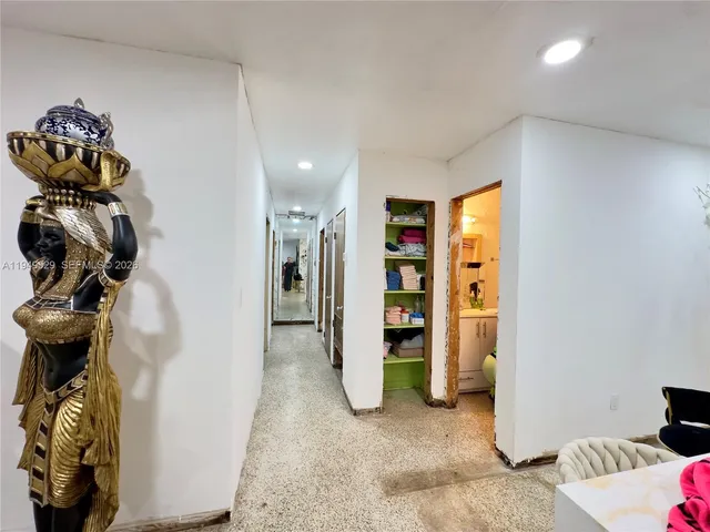 a bathroom with a sink toilet vanity and shower