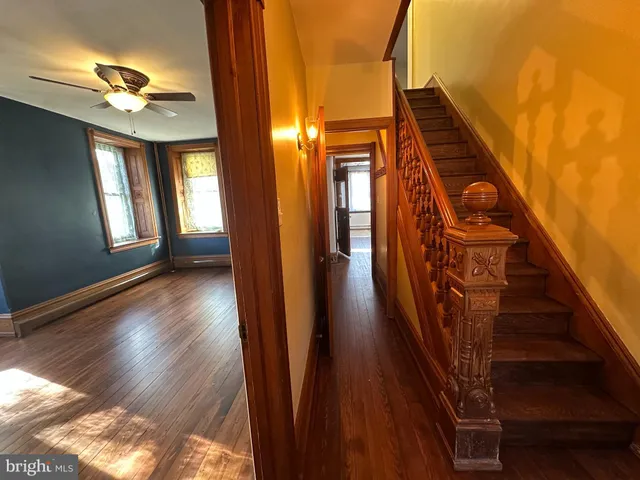 a view of an entryway with wooden floor