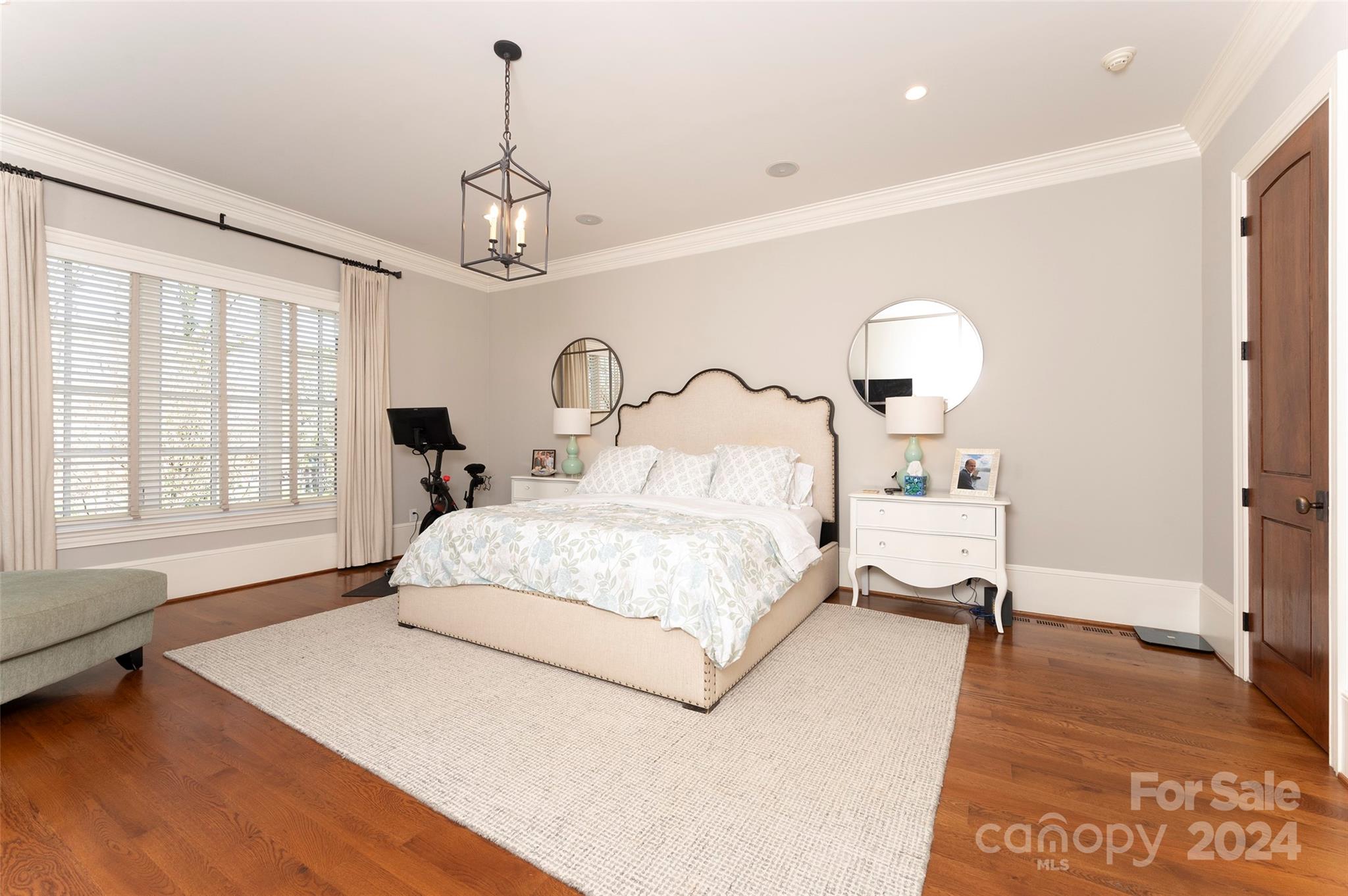 287 James Way Advance, NC 27006 - Photo 15 of 45 a bedroom with a bed chandelier and a window