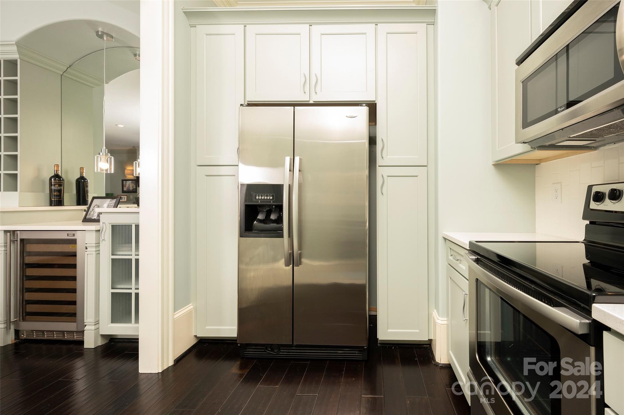 287 James Way Advance, NC 27006 - Photo 33 of 45 a kitchen with granite countertop a refrigerator and a stove