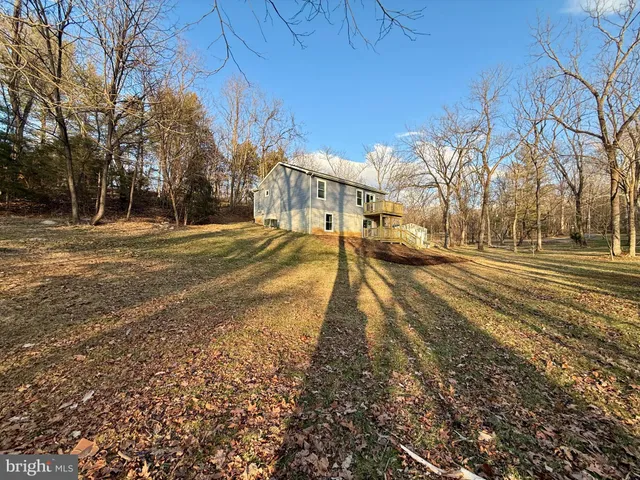 a living room with lots of furniture and a rug