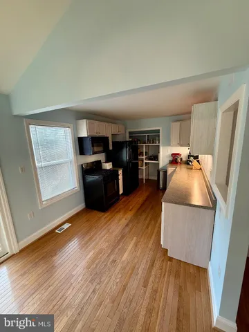 a bedroom with bed and window