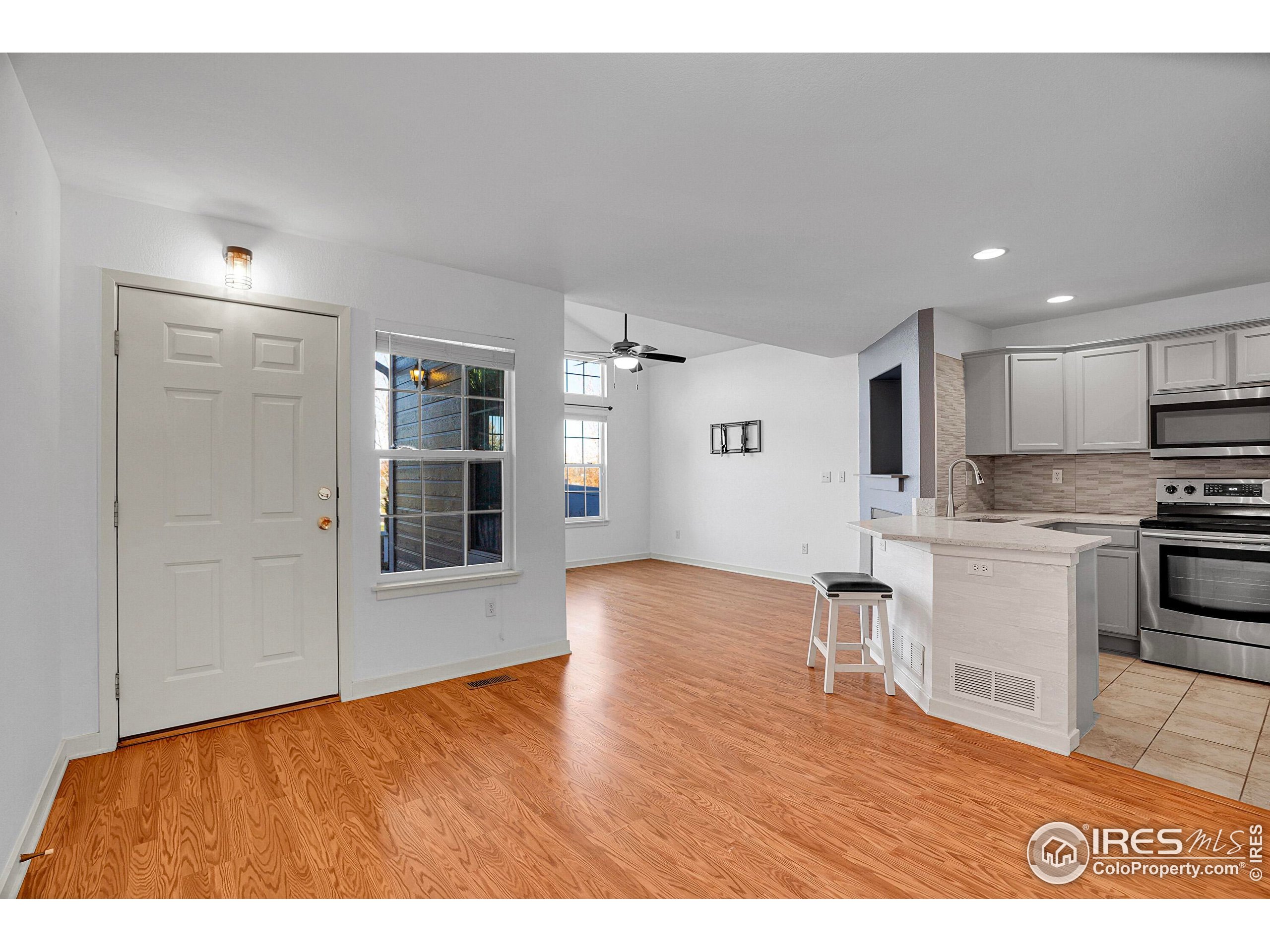 2408 Concord Circle Lafayette, CO 80026 - Photo 11 of 49 a view of kitchen with wooden floor