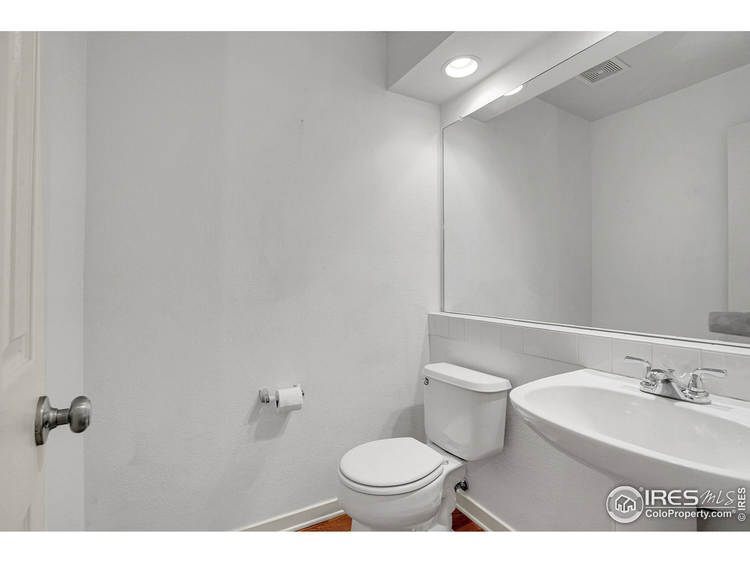 2408 Concord Circle Lafayette, CO 80026 - Photo 20 of 49 a bathroom with a sink and a toilet