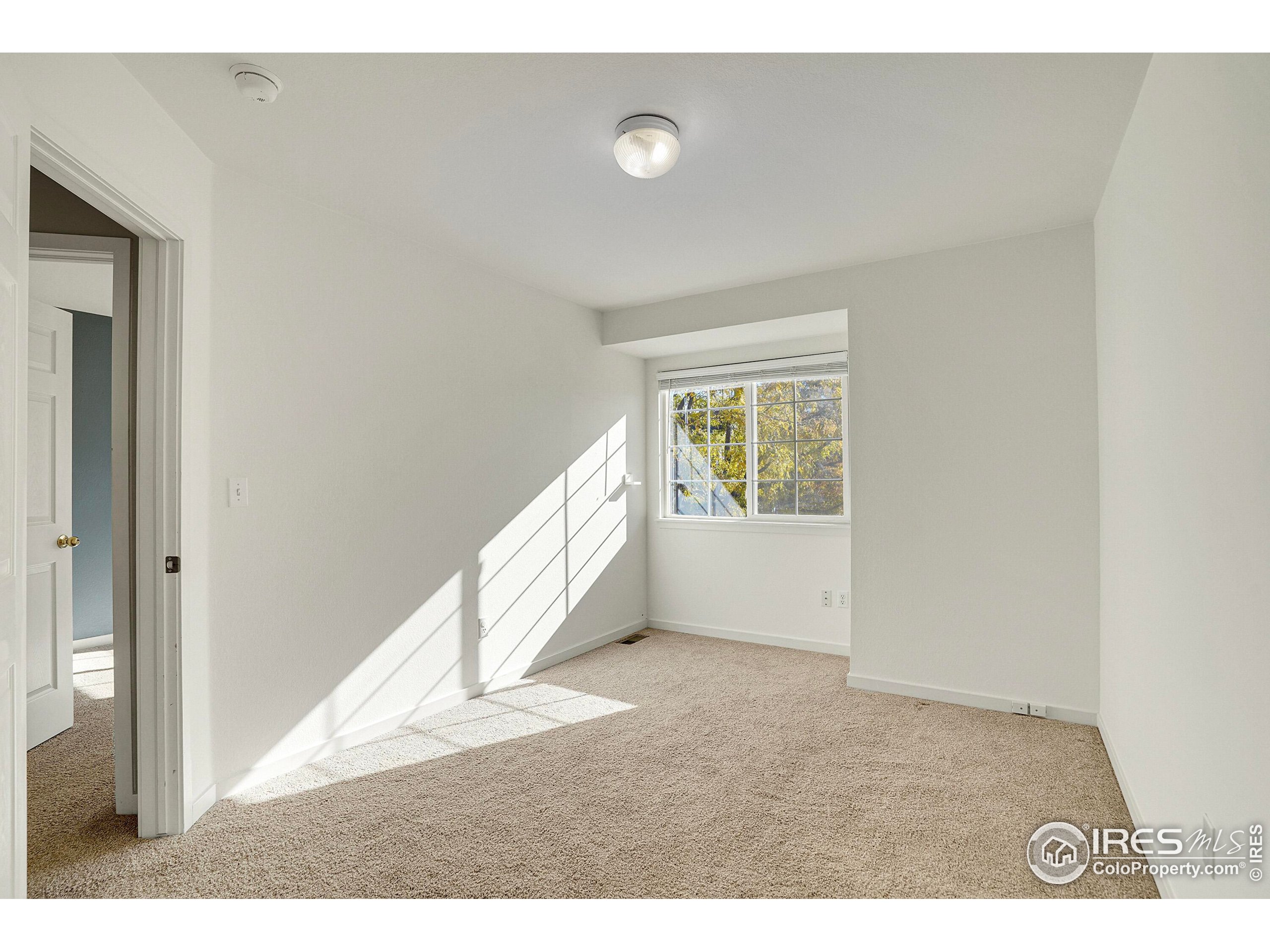 2408 Concord Circle Lafayette, CO 80026 - Photo 21 of 49 a view of an empty room and window