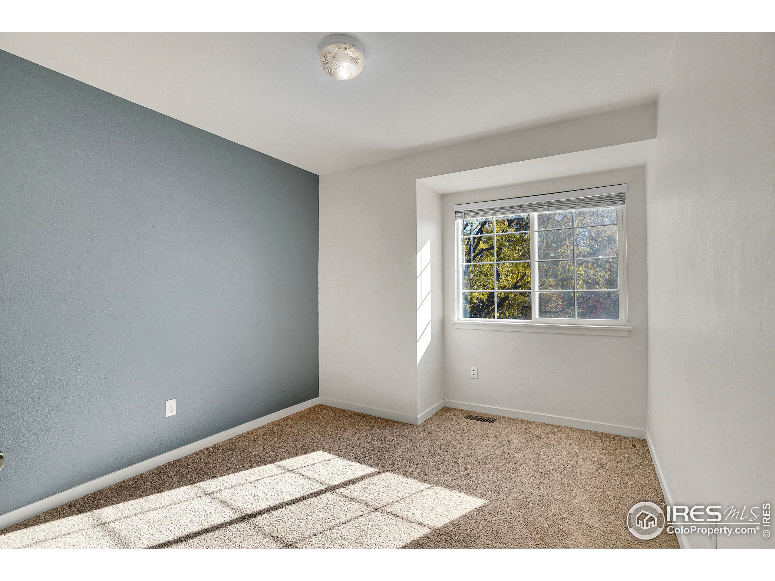 2408 Concord Circle Lafayette, CO 80026 - Photo 24 of 49 a view of an empty room with a window