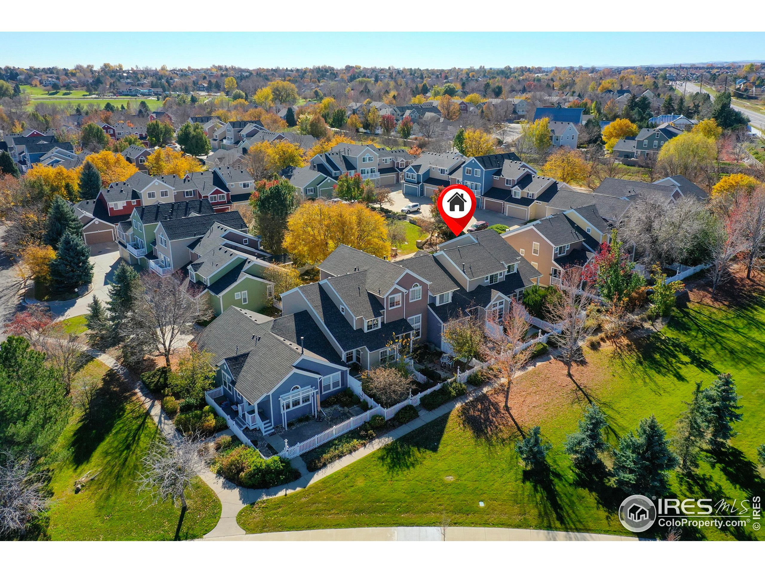 2408 Concord Circle Lafayette, CO 80026 - Photo 42 of 49 an aerial view of a house with a swimming pool lake and mountain view in back