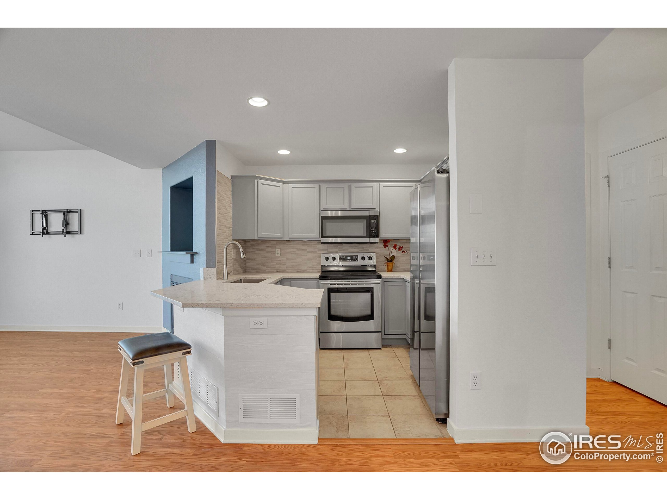 2408 Concord Circle Lafayette, CO 80026 - Photo 9 of 49 a kitchen with a sink cabinets stainless steel appliances and a counter top space