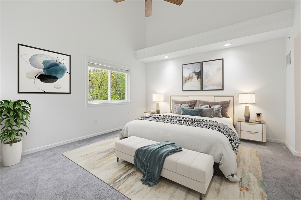 3002 Maple Brook Road, Unit 3002 Bellingham, MA 02019 - Photo 26 of 42 a bedroom with a bed and a couch