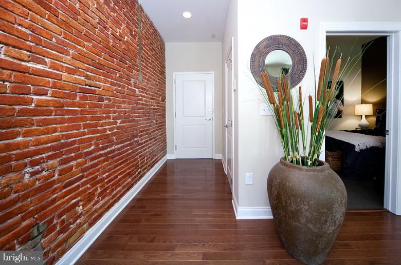 1201 North Charles Street, Unit 1BR Baltimore, MD 21201 - Photo 8 of 19 a view of entryway and hall with wooden floor