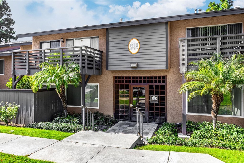 1410 West Lambert Road, Unit 202 La Habra, CA 90631 - Photo 1 of 30 a front view of a house with garden