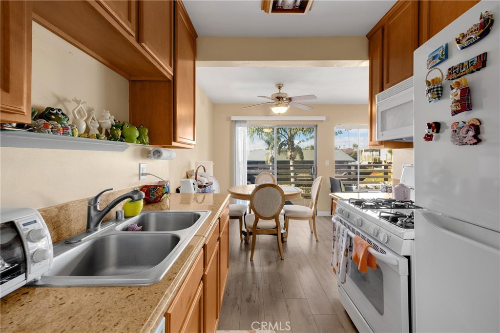 1410 West Lambert Road, Unit 202 La Habra, CA 90631 - Photo 11 of 30 a kitchen that has a sink and a stove
