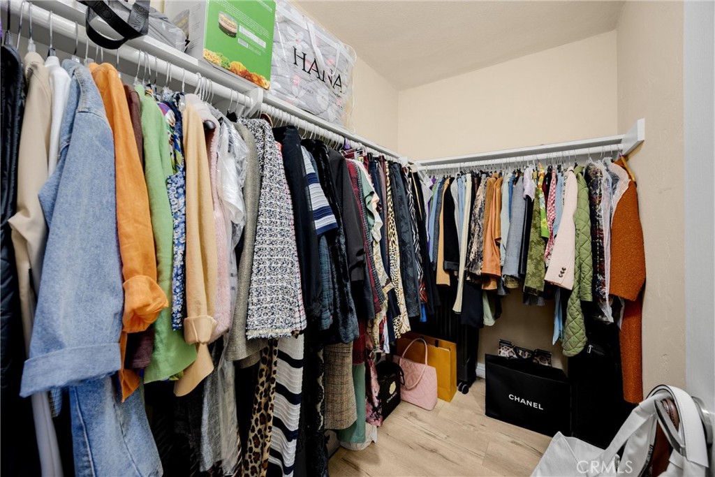 1410 West Lambert Road, Unit 202 La Habra, CA 90631 - Photo 18 of 30 a view of walk in closet with clothes and shoes