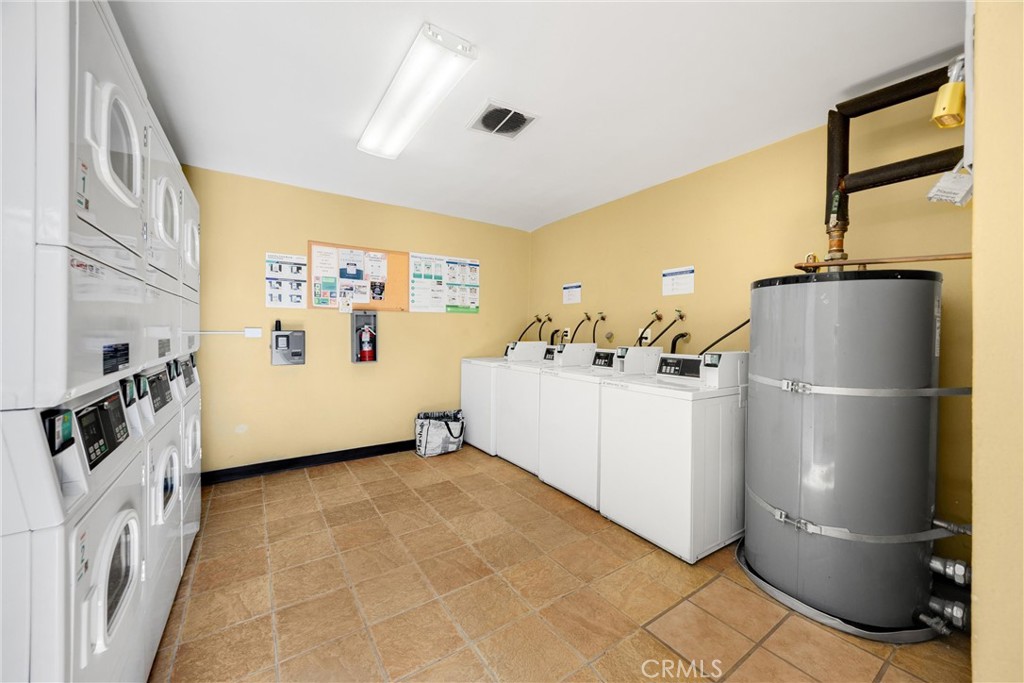 1410 West Lambert Road, Unit 202 La Habra, CA 90631 - Photo 22 of 30 a view of a kitchen with refrigerator and a stove